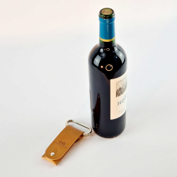 Metal two-prong corkscrew in its vegetable-tanned camel leather case