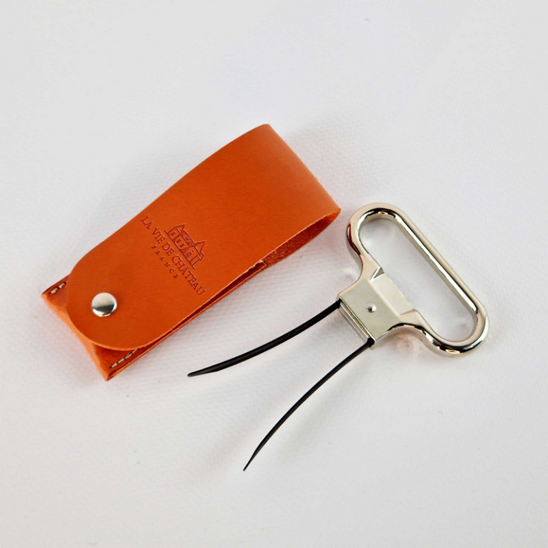 Metal two-prong corkscrew in its orange vegetable-tanned leather case