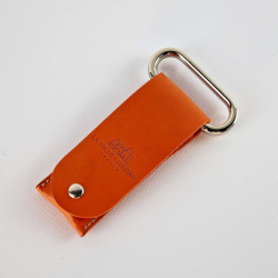 Metal two-prong corkscrew in its orange vegetable-tanned leather case