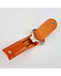 Metal two-prong corkscrew in its orange vegetable-tanned leather case