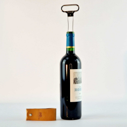 Two-pronged metal corkscrew in its Bordeaux vegetable-tanned leather case